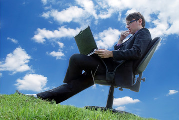 Businessman working with a laptop outdoor