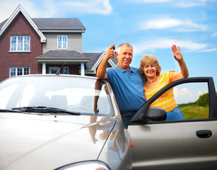 Elderly couple near their home