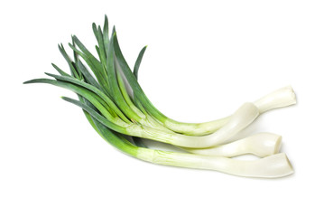 Bunch of onion. Green onion as background. Isolated on a white