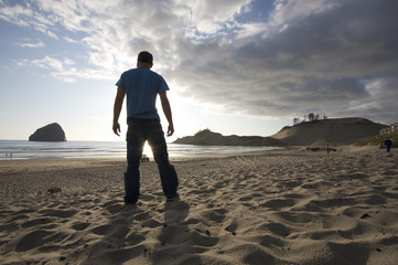 Person Standing at Beautiful Beach