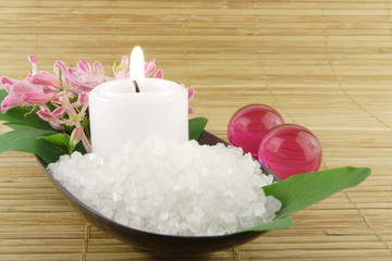 Pink flowers, candle and bath salt