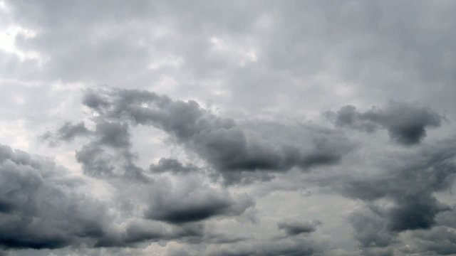 Time lapse clip of storm clouds over gray sky