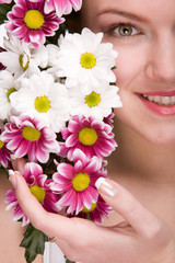 Attractive girl face with flowers