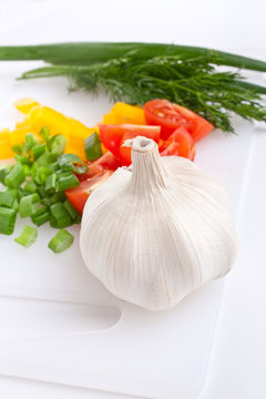 Vegetables On A Plastic Chopping Board