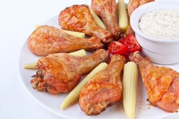 buffalo chicken legs served with cream sauce, cherry tomatoes an