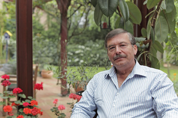 Resting man in his winter garden