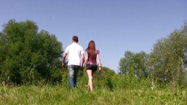 walking couple on grass