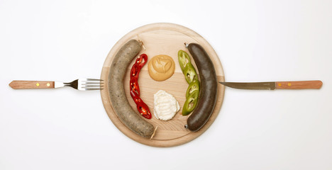 A wooden plate full of sausage 2