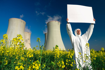 Man with sign at nuclear plant