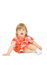 Small sitting baby in red dress