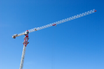 Lifting crane on building