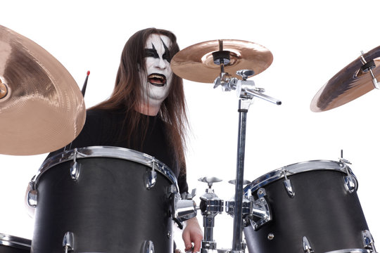 Screaming drummer with scenic makeup