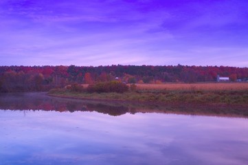 Fototapeta premium Field, water and farm building