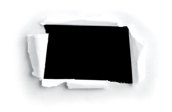 image d'un trou dans une feuille de papier pour message