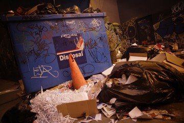 Overflowing garbage dumpster