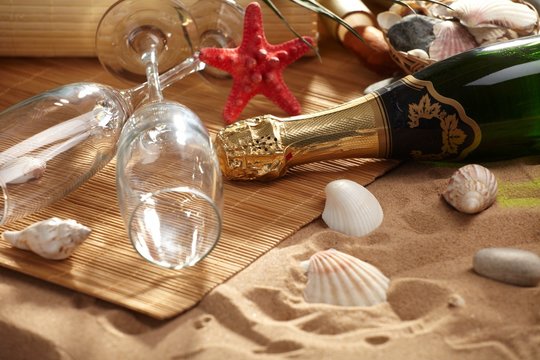 champagne sparkling on a beach