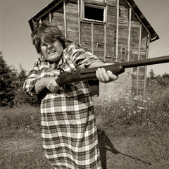 Angry woman with big gun
