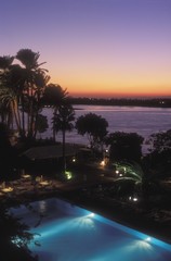 Obraz premium View over swimming pool, hotel, Nile River, Luxor, Egypt