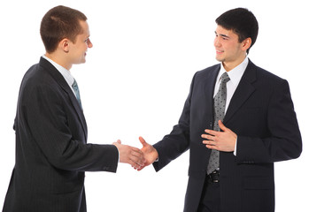 Two businessmen greet