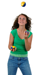 Isolated teenage girl juggling