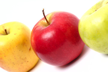 three multicolored apples in a row