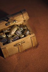 Golden beads in a box