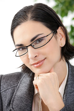 Portrait of thinking businesswoman