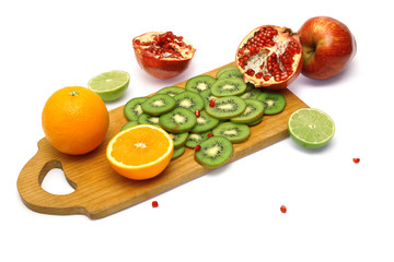 Board with cut fresh fruits