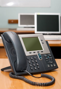 Modern digital phone on office table