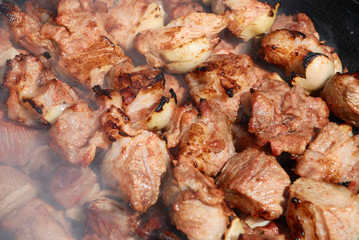 Preparation of meat on fire