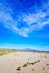 New Mexico, USA; Expansive desert with the Sierra Ladrones mountains in the distance
