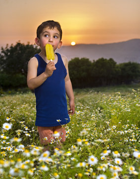 young boy having an popsicle