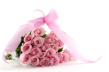 Bouquet of pink roses and ribbon isolated on white