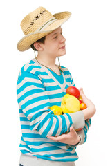 The young man in a straw hat with fruit