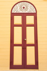 Monk's house door with Thai style wood carving