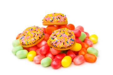 Sweet cakes and colourful gums at the background