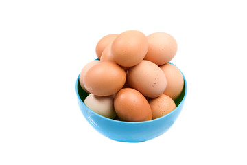 Photo of bowl with many brown hen eggs