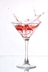 red cocktail on white