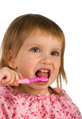 Cute young girl brushing her teeth