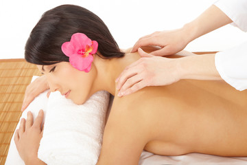Obraz na płótnie Canvas Woman in a spa getting a massage