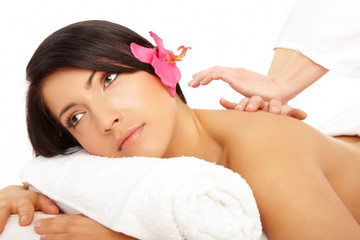 Attractive woman getting a massage in a spa
