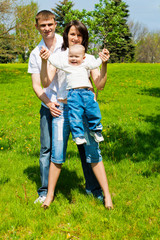 Fototapeta premium Parents playing with son