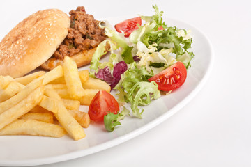 minced meat burger with french fries and salad