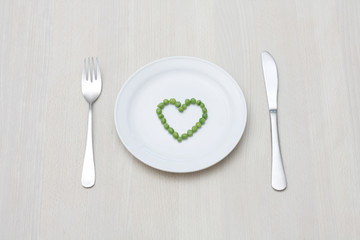 Peas in a heart-shape on a plate