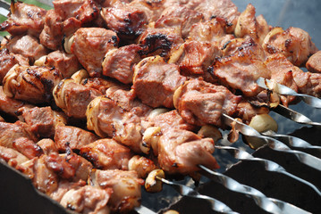 Preparation of meat on fire