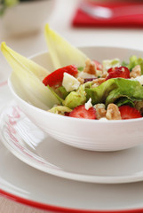 Green salad with goat's cheese,strawberries and walnuts.