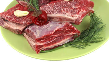 uncooked ribs on dish