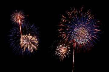Large variety of different beautiful fireworks on dark sky