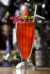 alcoholic cocktail with strawberry and piece of pineapple