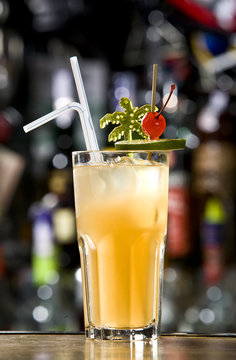 Orange cocktail on table, bar background